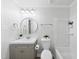 Well-lit bathroom featuring a vanity with a sink, a toilet, and a shower-tub combination at 689 Pine Ridge Pl, Raleigh, NC 27609