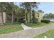 Charming two-story apartment building with mature trees, landscaping, and inviting entrance at 689 Pine Ridge Pl, Raleigh, NC 27609
