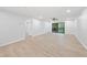 Bright and airy living room boasting wood floors and access to a cozy outdoor balcony at 689 Pine Ridge Pl, Raleigh, NC 27609