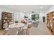 Bright living room with hardwood floors, neutral decor, and sliding door access to a deck at 689 Pine Ridge Pl, Raleigh, NC 27609