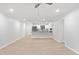 Open living space with wood floors connecting the living room and kitchen areas at 689 Pine Ridge Pl, Raleigh, NC 27609