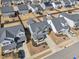 Beautiful aerial view of homes with fenced yards, neat landscaping, and neighborhood amenities at 730 Tibumoll Ln, Fuquay Varina, NC 27526