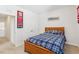 Comfortable bedroom features a wooden bed frame, soft bedding, and ample closet space at 730 Tibumoll Ln, Fuquay Varina, NC 27526