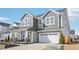 Charming two-story home with beautiful gray wood and stone accents and a two car garage at 730 Tibumoll Ln, Fuquay Varina, NC 27526