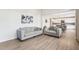 Living area showcasing stylish furniture and an open layout leading to the kitchen at 730 Tibumoll Ln, Fuquay Varina, NC 27526