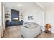 Bright living room featuring stylish sofas, custom built-ins with shelves, and modern decor at 730 Tibumoll Ln, Fuquay Varina, NC 27526