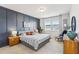 Serene main bedroom features a paneled accent wall and coordinated decor at 730 Tibumoll Ln, Fuquay Varina, NC 27526