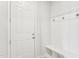 Bright mudroom with a white door, board and batten style accent wall, and bench with storage at 730 Tibumoll Ln, Fuquay Varina, NC 27526
