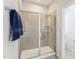 Modern walk-in shower with glass enclosure and tiled walls at 730 Tibumoll Ln, Fuquay Varina, NC 27526