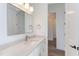 Bathroom featuring a single vanity with stone counters, with doorway open to adjacent room at 75 Harvest View Way, Franklinton, NC 27525