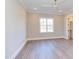 Bright bedroom featuring a ceiling fan and easy access to a spacious walk-in closet at 75 Harvest View Way, Franklinton, NC 27525