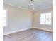Spacious bedroom with ample natural light and a ceiling fan for added comfort at 75 Harvest View Way, Franklinton, NC 27525