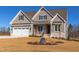 Charming single-Gathering home with a two-car garage and craftsman-style details on a sunny day at 75 Harvest View Way, Franklinton, NC 27525