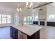 Kitchen boasting an island, granite countertops, stainless appliances, and a seamless connection to living space at 75 Harvest View Way, Franklinton, NC 27525