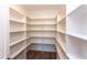 Spacious walk-in pantry with custom shelving to maximize storage space in the kitchen at 75 Harvest View Way, Franklinton, NC 27525