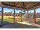 Screened-in porch with wood floors, wood ceiling and ceiling fan at 75 Harvest View Way, Franklinton, NC 27525