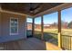Enclosed porch with wood floors, wood ceiling and ceiling fan at 75 Harvest View Way, Franklinton, NC 27525