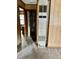 Interior view of a home featuring a large, vintage heater and wood paneled walls at 750 David St, Henderson, NC 27536
