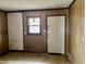 View of room showing a small window and an entry door at 750 David St, Henderson, NC 27536