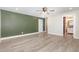 Large primary bedroom with neutral walls and a connected full ensuite bath at 7722 Nc 27 W, Lillington, NC 27546