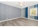 bedroom featuring fun wall paper and a ceiling fan for added comfort at 7722 Nc 27 W, Lillington, NC 27546