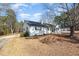 Spacious single story with mature trees and a long driveway at 7722 Nc 27 W, Lillington, NC 27546