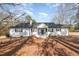 Charming single-story home with a well-maintained yard and inviting front porch at 7722 Nc 27 W, Lillington, NC 27546