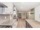Charming kitchen with granite counters, stainless steel sink, and views to the living space at 7722 Nc 27 W, Lillington, NC 27546
