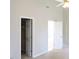 Bedroom showcasing an open closet and access to a private bathroom at 8 Weeping Beech Way, Durham, NC 27713
