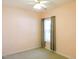 This bedroom features light pink walls, neutral carpet and light coming from a window at 8 Weeping Beech Way, Durham, NC 27713