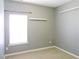 This bedroom features a neutral color palette, window, an outlet and 2 shelves at 8 Weeping Beech Way, Durham, NC 27713