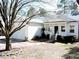 Charming single-story home with a welcoming porch and well-maintained front yard at 8 Weeping Beech Way, Durham, NC 27713