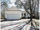 Inviting single-story home featuring a front porch, attached garage, and driveway at 8 Weeping Beech Way, Durham, NC 27713