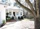 Inviting home exterior featuring a cozy front porch and landscaped yard at 8 Weeping Beech Way, Durham, NC 27713