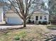 Charming one-story home with a landscaped front yard and a welcoming entrance porch at 8 Weeping Beech Way, Durham, NC 27713