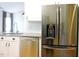 Kitchen area showcasing stainless steel refrigerator, dishwasher and sink at 8 Weeping Beech Way, Durham, NC 27713