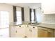 Kitchen featuring a stainless steel sink, updated appliances, and sleek countertops at 8 Weeping Beech Way, Durham, NC 27713
