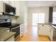 Well-equipped kitchen with stainless steel appliances and white cabinetry at 8 Weeping Beech Way, Durham, NC 27713