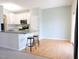 Spacious kitchen featuring a breakfast bar, white cabinets and stainless steel appliances at 8 Weeping Beech Way, Durham, NC 27713