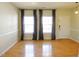 Bright living area featuring gleaming hardwood floors and neutral walls at 8 Weeping Beech Way, Durham, NC 27713