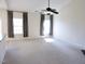 Spacious living room with large windows and neutral carpeting at 8 Weeping Beech Way, Durham, NC 27713