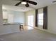 Spacious living room with ample natural light and view of the kitchen breakfast bar at 8 Weeping Beech Way, Durham, NC 27713