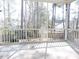 A screened-in porch with plenty of space for relaxing and enjoying the fresh air at 8 Weeping Beech Way, Durham, NC 27713