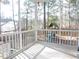 A screened-in porch with plenty of space, view and a slide for fun at 8 Weeping Beech Way, Durham, NC 27713