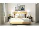 Bright bedroom featuring decorative wall art and a wooden bed frame at 917 Thimbleweed Way, Wake Forest, NC 27587