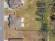 Aerial view of a home with a spacious, fenced backyard and mature trees at 99 Preserve Dr, Benson, NC 27504