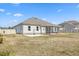 Large backyard with a screened-in porch that allows for outdoor enjoyment at 99 Preserve Dr, Benson, NC 27504