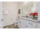 This bathroom features a granite countertop, a large mirror, and updated hardware at 99 Preserve Dr, Benson, NC 27504