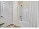 A clean bathroom with a shower-tub combo and white door at 99 Preserve Dr, Benson, NC 27504