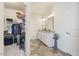 The bathroom features dual sinks with granite counters, tile flooring, and a walk-in closet at 99 Preserve Dr, Benson, NC 27504